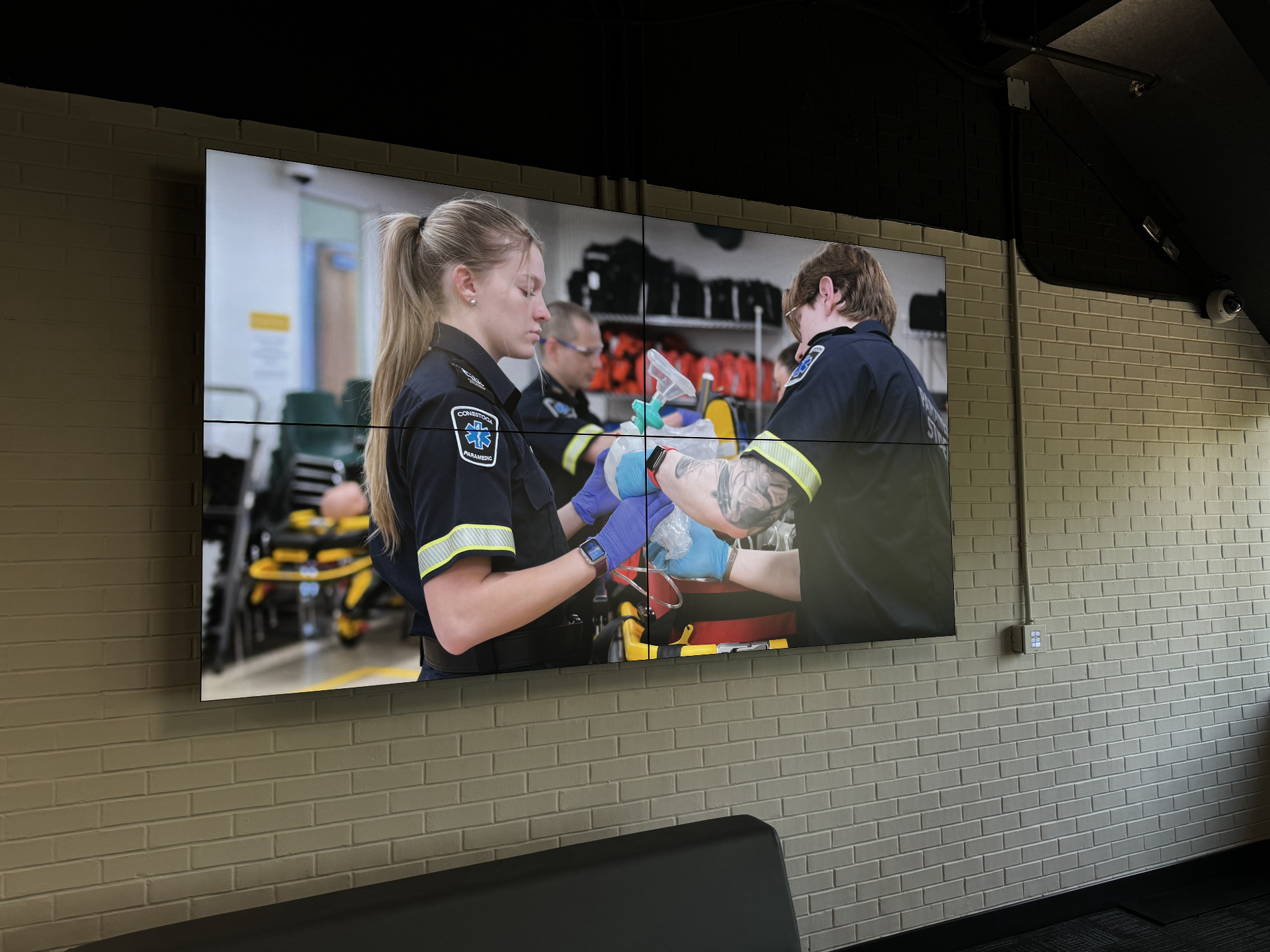 Video wall showing student programming in a Collingwood-area campus space