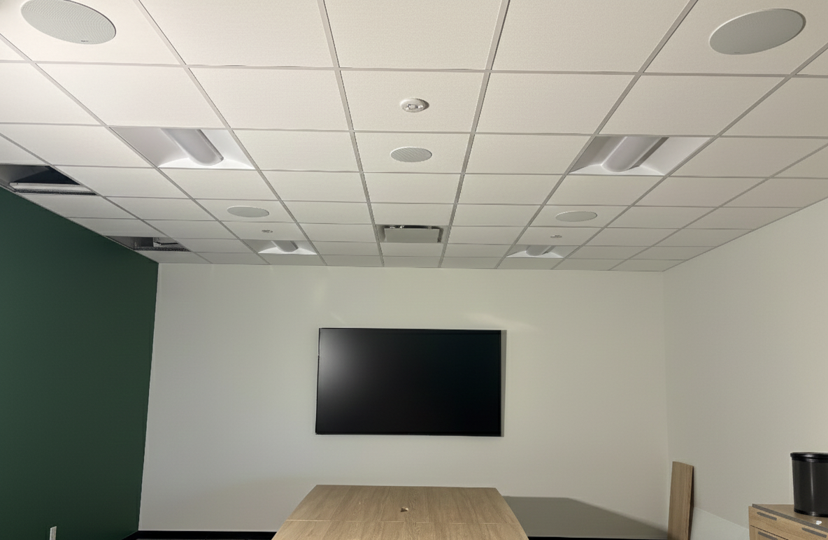 Collingwood conference room with ceiling speakers and display