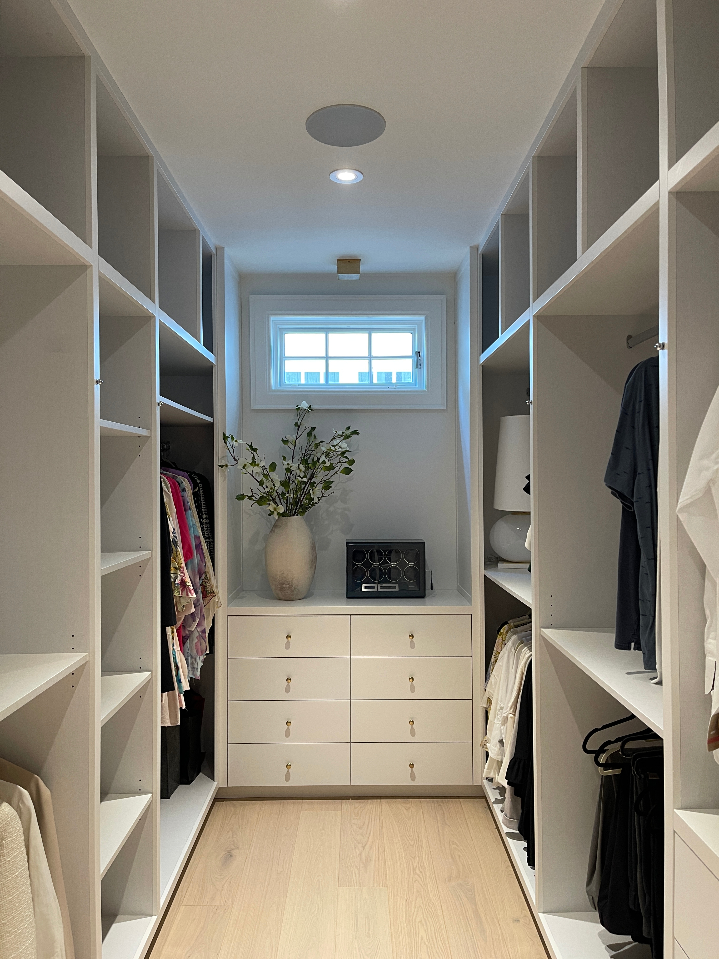Custom walk-in closet with integrated smart home controls and lighting