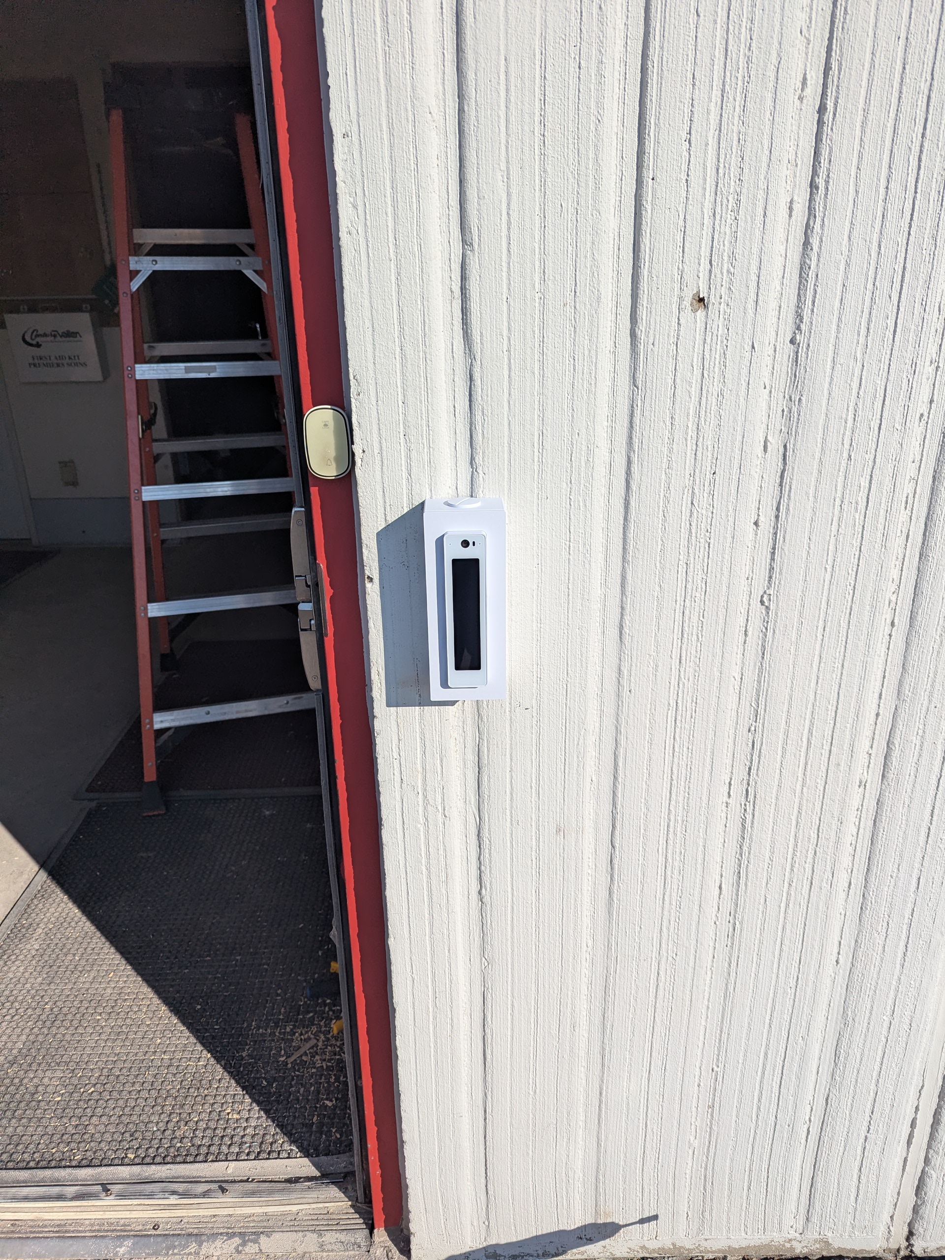 Technician performing a retrofit cable pull at a Wasaga Beach commercial site