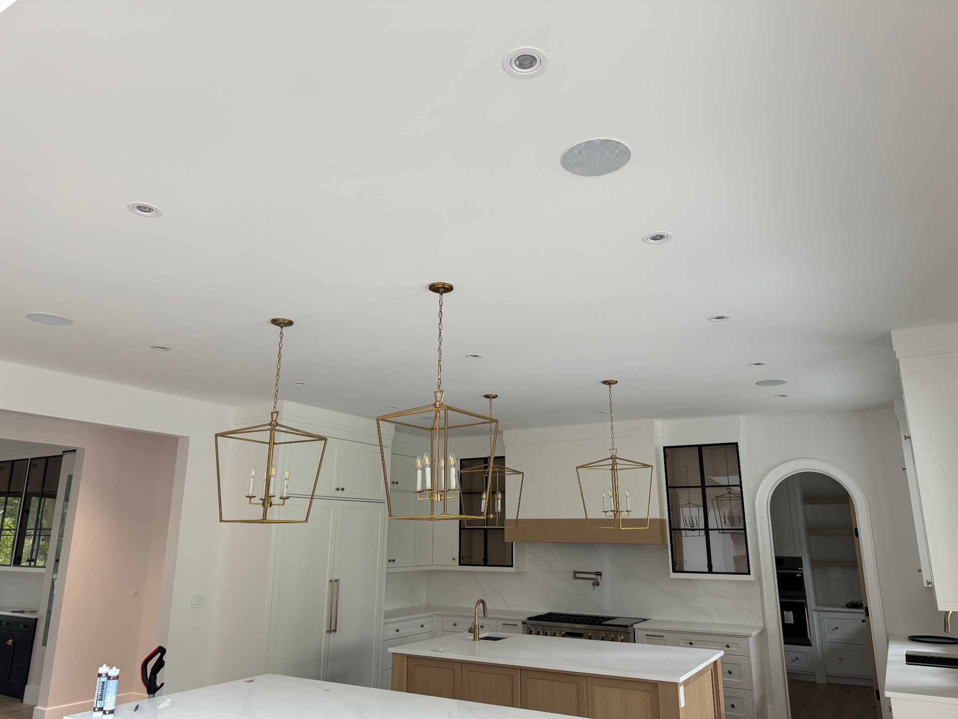 B&W in-ceiling speakers in a modern Blue Mountains kitchen