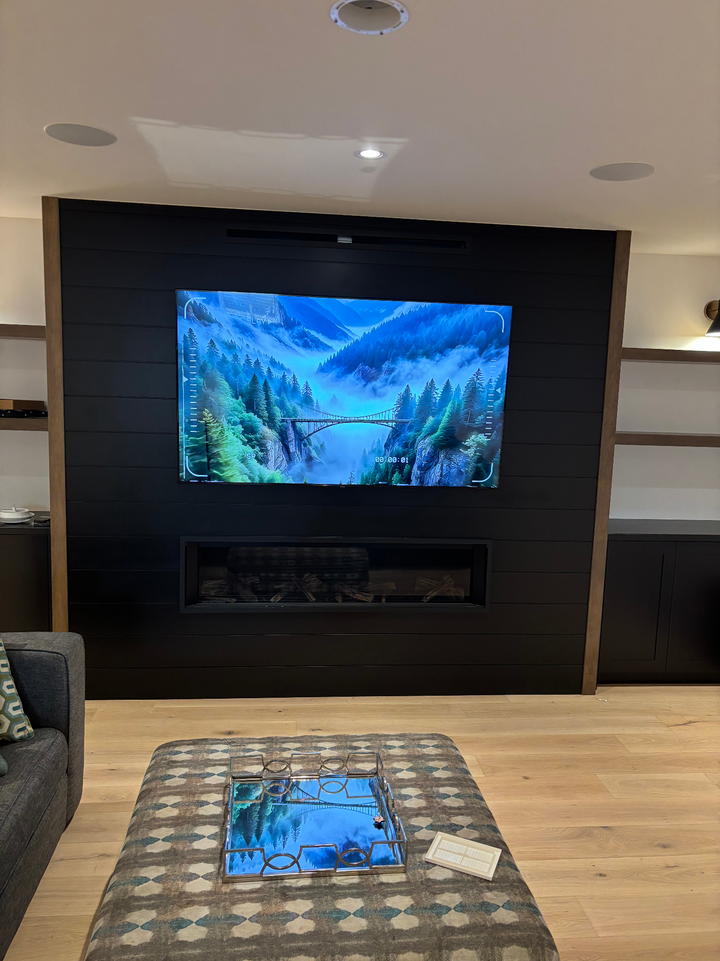 Samsung TV mounted above fireplace with B&W ceiling speakers in a Blue Mountains new build
