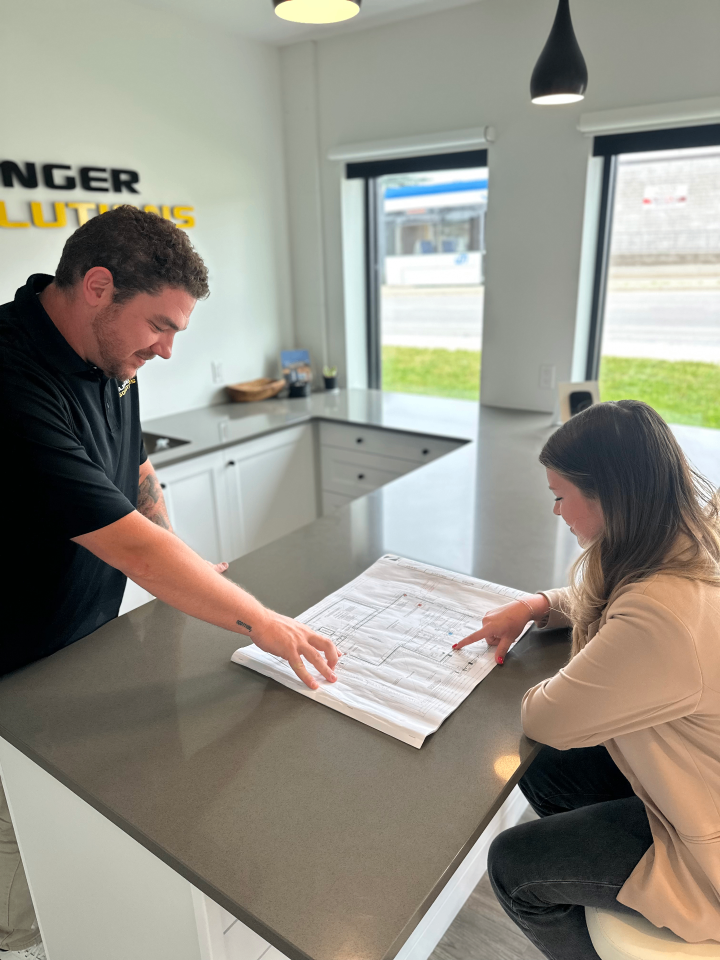 Summit Logic team reviewing residential plans with a client in Georgian Bay