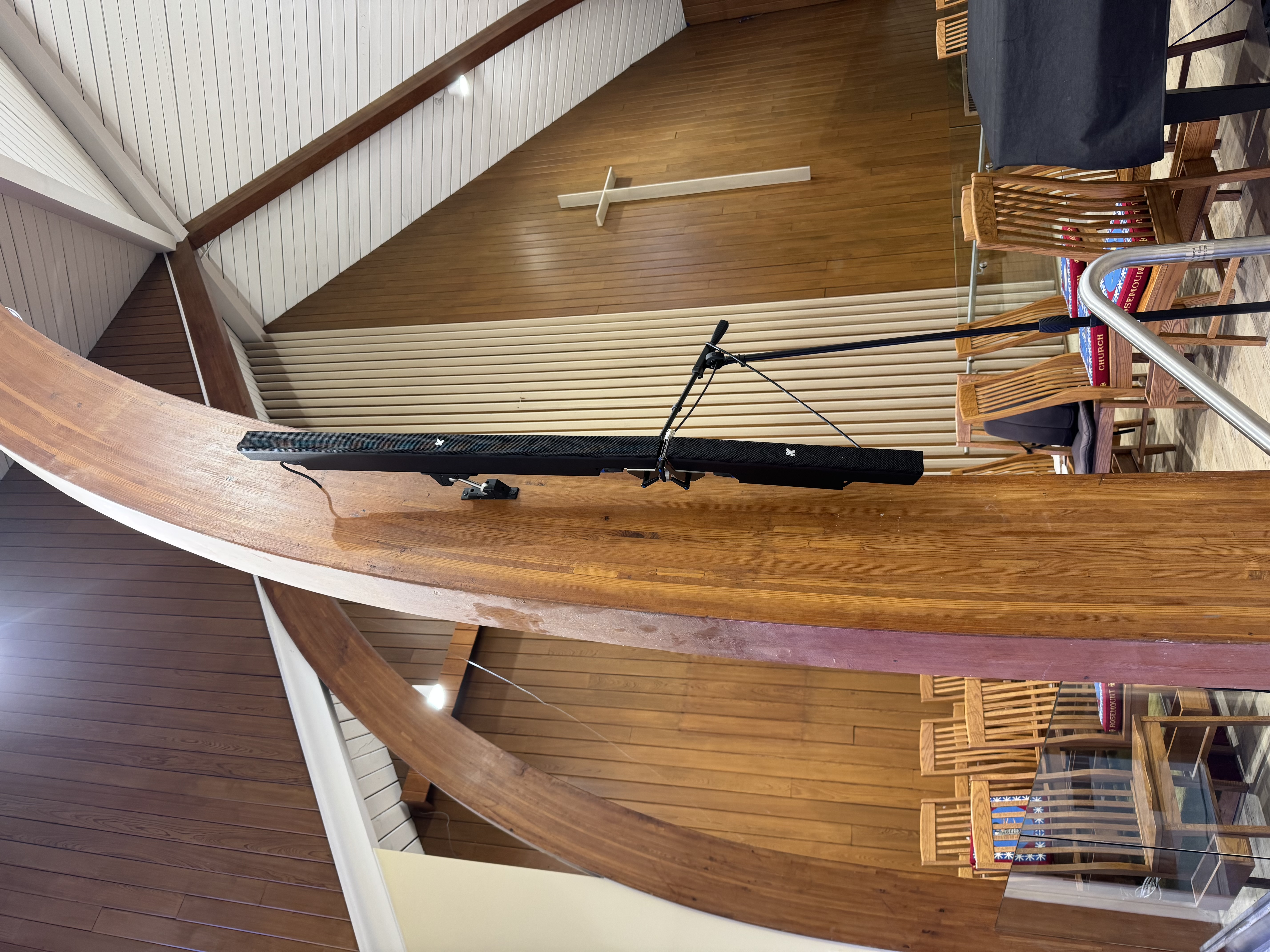 Professional line-array speaker mounting on a Collingwood venue wall