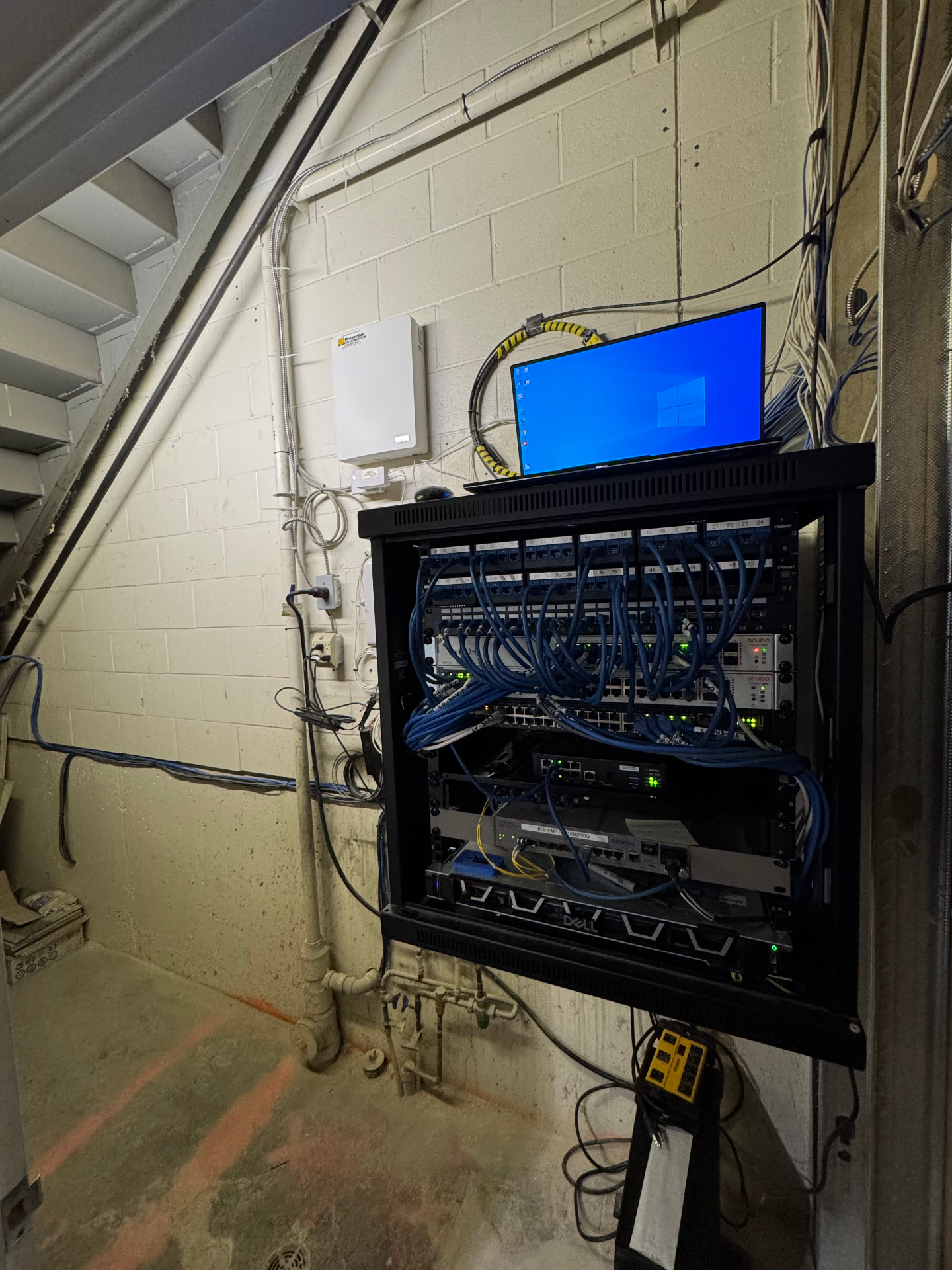 Professionally organized smart home system with clean cable management and proper installation