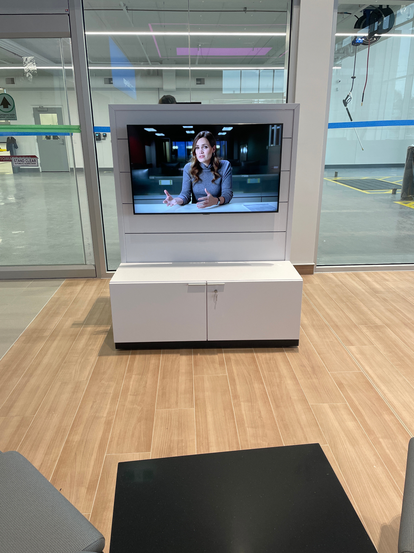 Showroom TV with custom millwork integration at a Collingwood dealership